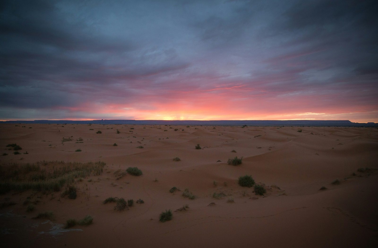 view of sand dunes during golden hour